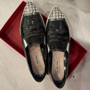 Miu Miu slip on sneakers.